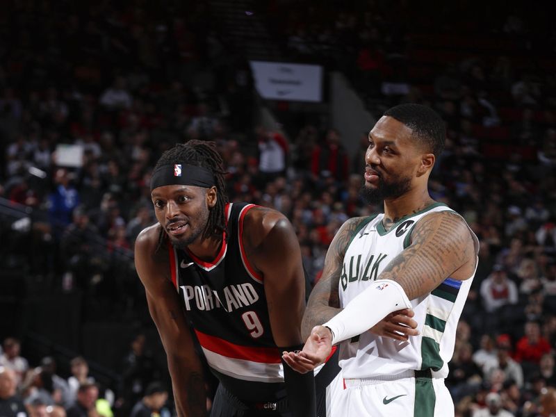 PORTLAND, OR - JANUARY 31:  Jerami Grant #9 of the Portland Trail Blazers & Damian Lillard #0 of the Milwaukee Bucks looks on during the game on January 31, 2024 at the Moda Center Arena in Portland, Oregon. NOTE TO USER: User expressly acknowledges and agrees that, by downloading and or using this photograph, user is consenting to the terms and conditions of the Getty Images License Agreement. Mandatory Copyright Notice: Copyright 2024 NBAE (Photo by Cameron Browne/NBAE via Getty Images)