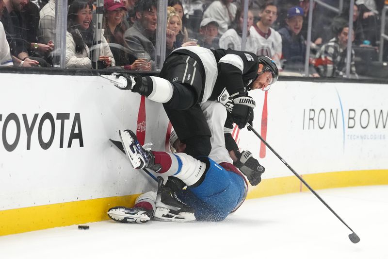 Mar 2, 2026; Los Angeles, California, USA; LA Kings defenseman Joel Edmundson (6) collides with Colorado Avalanche center Zakhar Bardakov (93) in the first period at Crypto.com Arena. Mandatory Credit: Kirby Lee-Imagn Images
