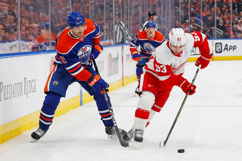 Feb 13, 2024; Edmonton, Alberta, CAN; Detroit Red Wings forward Alex DeBeincat (93) carries the puck around Edmonton Oilers defensemen Evan Bouchard (2) during the second period at Rogers Place. Mandatory Credit: Perry Nelson-USA TODAY Sports