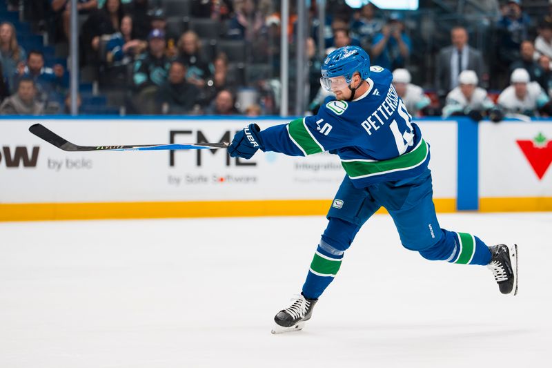 Sep 26, 2025; Vancouver, British Columbia, CAN; Vancouver Canucks forward Elias Pettersson (40) shoots against the Seattle Kraken in the third period at Rogers Arena. Mandatory Credit: Bob Frid-Imagn Images