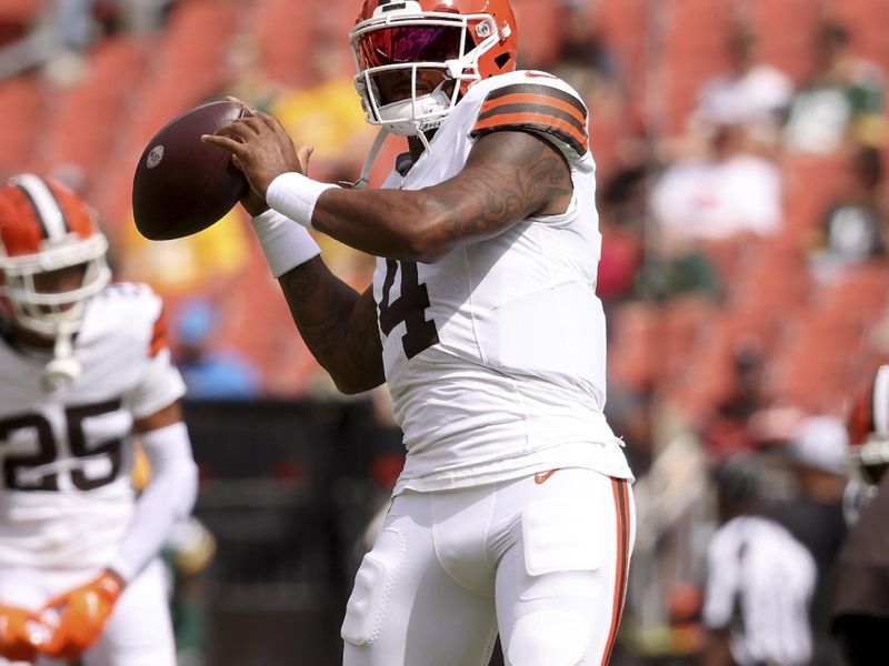 Cleveland Browns quarterback Deshaun Watson (4) warms up prior to the start of a preseason NFL football game against the Green Bay Packers, Saturday, Aug. 10, 2024, in Cleveland. (AP Photo/Kirk Irwin)