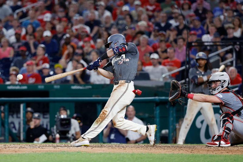 Jul 20, 2024; Washington, District of Columbia, USA; Washington Nationals outfielder Jacob Young (30) hits a go ahead RBI single against the Cincinnati Reds during the eighth inning at Nationals Park. Mandatory Credit: Geoff Burke-USA TODAY Sports