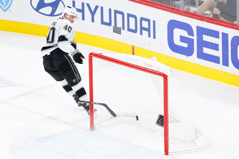 Oct 26, 2025; Chicago, Illinois, USA; Los Angeles Kings right wing Joel Armia (40) scores against the Chicago Blackhawks on the empty-net as he breaks his stick during the third period at United Center. Mandatory Credit: Kamil Krzaczynski-Imagn Images