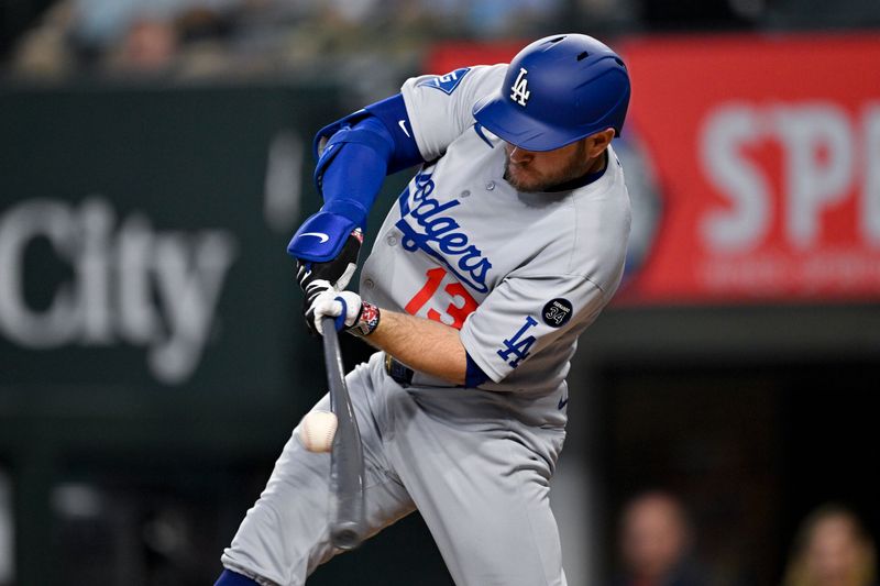Apr 20, 2025; Arlington, Texas, USA; Los Angeles Dodgers third baseman Max Muncy (13) bats against the Texas Rangers during the seventh inning at Globe Life Field. Mandatory Credit: Jerome Miron-Imagn Images