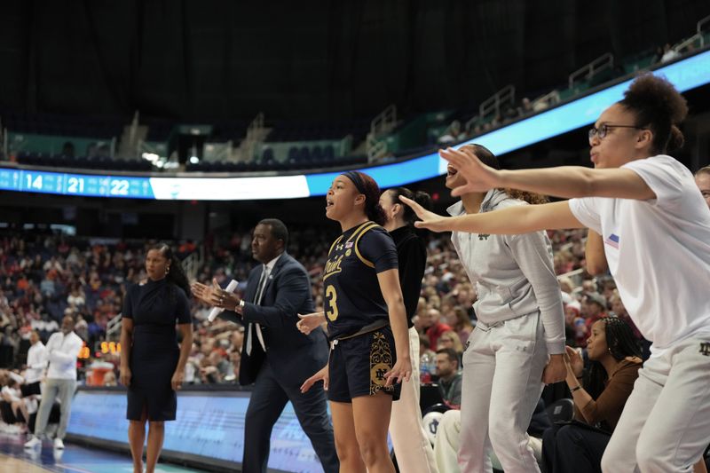 Mar 9, 2024; Greensboro, NC, USA; Notre Dame Fighting Irish players react to action on the court during the second half against the Virginia Tech Hokies at Greensboro Coliseum. Mandatory Credit: David Yeazell-USA TODAY Sports