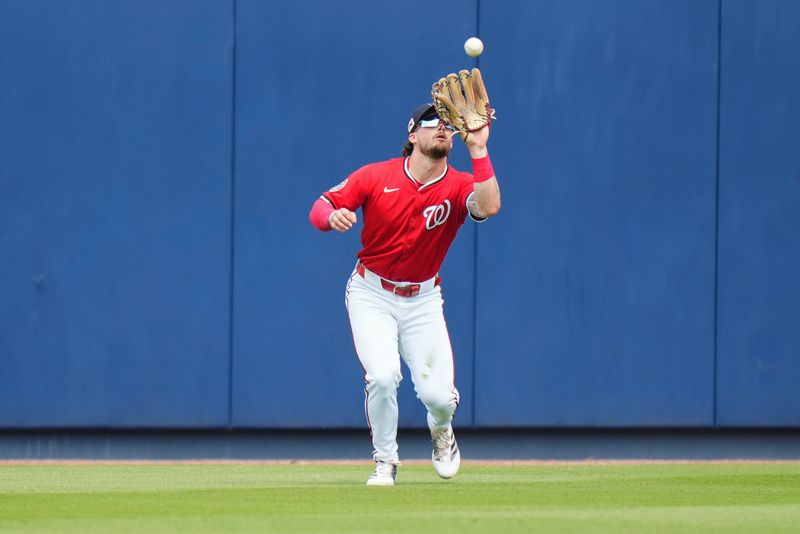 Mar 4, 2025; West Palm Beach, Florida, USA; Washington Nationals outfielder Dylan Crews (3) catches a fly ball against the St. Louis Cardinals during the third inning at CACTI Park of the Palm Beaches. Mandatory Credit: Rich Storry-Imagn Images