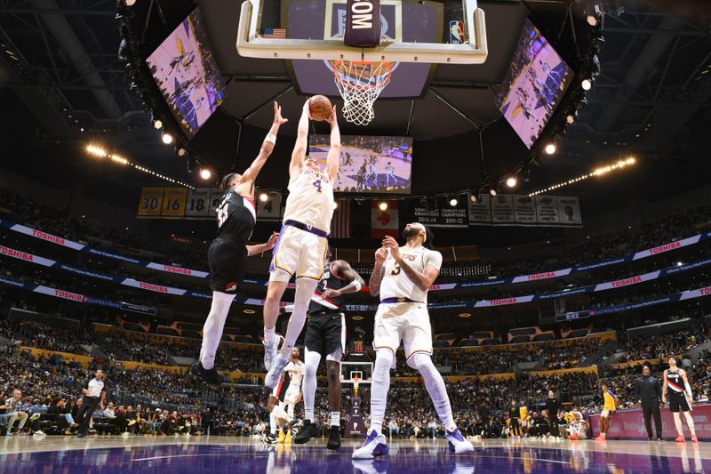 LOS ANGELES, CA - DECEMBER 8: Dalton Knecht #4 of the Los Angeles Lakers dunks the ball during the game against the Portland Trail Blazers on December 8, 2024 at Crypto.Com Arena in Los Angeles, California. NOTE TO USER: User expressly acknowledges and agrees that, by downloading and/or using this Photograph, user is consenting to the terms and conditions of the Getty Images License Agreement. Mandatory Copyright Notice: Copyright 2024 NBAE (Photo by Adam Pantozzi/NBAE via Getty Images)