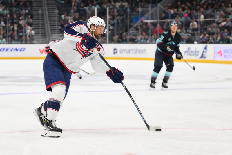 Nov 12, 2024; Seattle, Washington, USA; Columbus Blue Jackets center Sean Kuraly (7) shoots a goal shot against the Seattle Kraken during the second period at Climate Pledge Arena. Mandatory Credit: Steven Bisig-Imagn Images