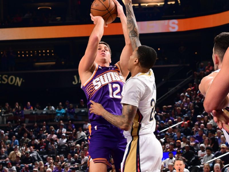 PHOENIX, AZ - FEBRUARY 27: Collin Gillespie #12 of the Phoenix Suns shoots the ball during the game against the New Orleans Pelicans on February 27, 2025 at PHX Arena in Phoenix, Arizona. NOTE TO USER: User expressly acknowledges and agrees that, by downloading and or using this photograph, user is consenting to the terms and conditions of the Getty Images License Agreement. Mandatory Copyright Notice: Copyright 2025 NBAE (Photo by Kate Frese/NBAE via Getty Images)