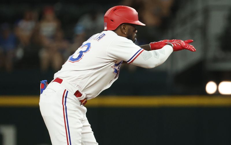 Jun 28, 2023; Arlington, Texas, USA; Texas Rangers right fielder Adolis Garcia (53) reacts after hitting an rbi double during the seventh inning against the Detroit Tigers at Globe Life Field. Mandatory Credit: Kevin Jairaj-USA TODAY Sports