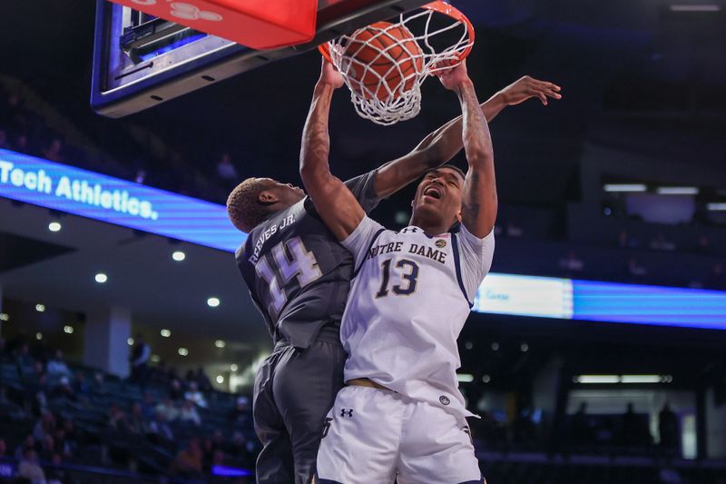 Jan 9, 2024; Atlanta, Georgia, USA; Notre Dame Fighting Irish forward Tae Davis (13) dunks past Georgia Tech Yellow Jackets guard Kowacie Reeves Jr. (14) in the first half at McCamish Pavilion. Mandatory Credit: Brett Davis-USA TODAY Sports