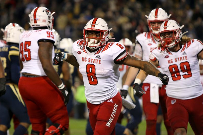 Nov 21, 2019; Atlanta, GA, USA; North Carolina State Wolfpack running back Ricky Person Jr. (8) celebrates after a touchdown run against the Georgia Tech Yellow Jackets in the second half at Bobby Dodd Stadium. Mandatory Credit: Brett Davis-USA TODAY Sports