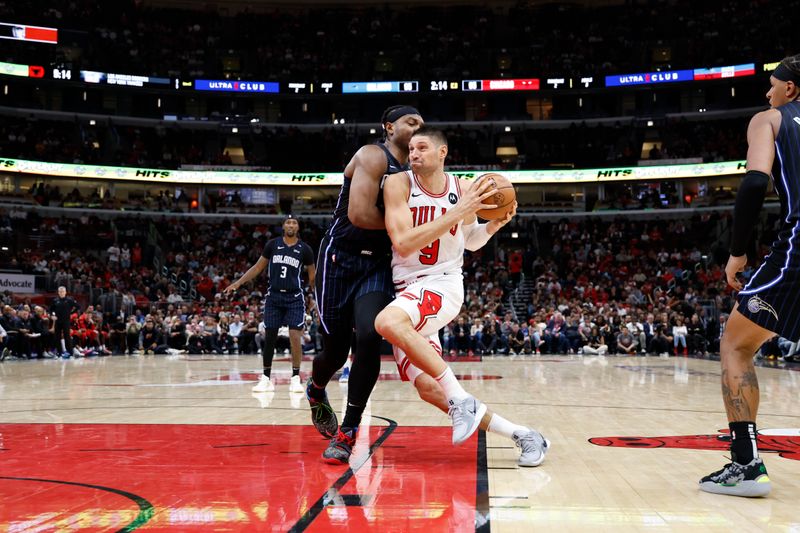 CHICAGO, IL - OCTOBER 30: Nikola Vucevic #9 of the Chicago Bulls drives to the basket during the game against the Orlando Magic on October 30, 2024 at United Center in Chicago, Illinois. NOTE TO USER: User expressly acknowledges and agrees that, by downloading and or using this photograph, User is consenting to the terms and conditions of the Getty Images License Agreement. Mandatory Copyright Notice: Copyright 2024 NBAE (Photo by Kamil Krzaczynski/NBAE via Getty Images)