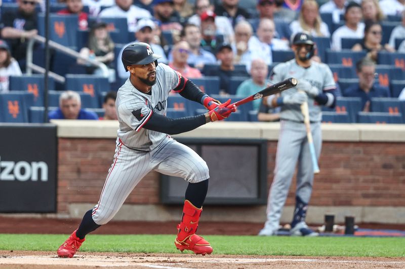 Jul 29, 2024; New York City, New York, USA;  Minnesota Twins center fielder Byron Buxton (25) hits an RBI single in the first inning against the New York Mets at Citi Field. Mandatory Credit: Wendell Cruz-USA TODAY Sports