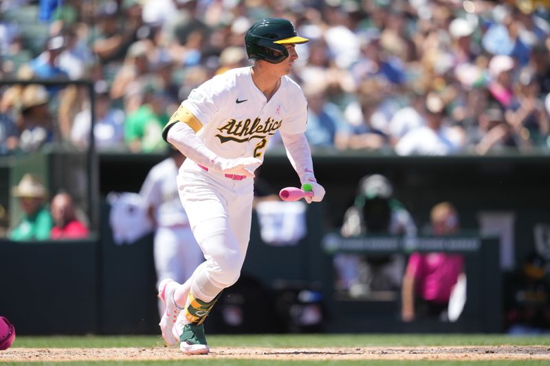 May 11, 2025; West Sacramento, California, USA; Athletics left fielder Tyler Soderstrom (21) watches the ball after hitting a single against the New York Yankees in the fourth inning at Sutter Health Park. Mandatory Credit: Cary Edmondson-Imagn Images