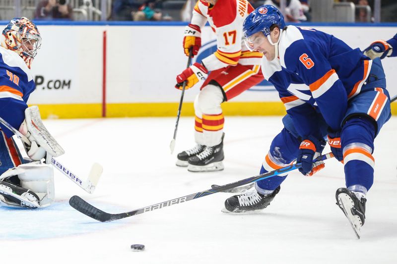 Feb 10, 2024; Elmont, New York, USA;  New York Islanders defenseman Ryan Pulock (6) chases the puck in the first period against the Calgary Flames at UBS Arena. Mandatory Credit: Wendell Cruz-USA TODAY Sports