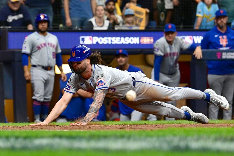 Oct 3, 2024; Milwaukee, Wisconsin, USA; New York Mets outfielder Jesse Winker (3) scores against the Milwaukee Brewers in the ninth inning during game three of the Wildcard round for the 2024 MLB Playoffs at American Family Field. Mandatory Credit: Benny Sieu-Imagn Images