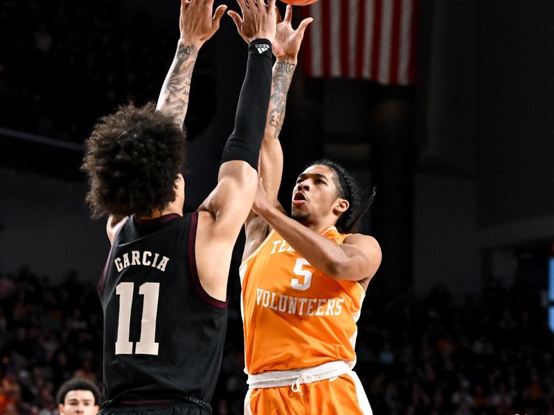 Feb 21, 2023; College Station, Texas, USA;  Tennessee Volunteers guard Zakai Zeigler (5) shoots over Texas A&M Aggies forward Andersson Garcia (11) during the first half at Reed Arena. Mandatory Credit: Maria Lysaker-USA TODAY Sports