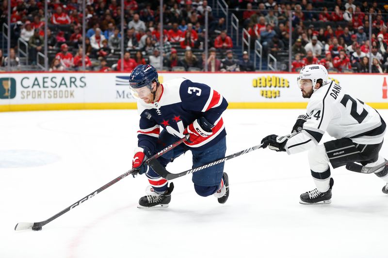 Jan 7, 2024; Washington, District of Columbia, USA; Washington Capitals defenseman Nick Jensen (3) controls the puck as Los Angeles Kings center Phillip Danault (24) defends during the first period at Capital One Arena. Mandatory Credit: Amber Searls-USA TODAY Sports