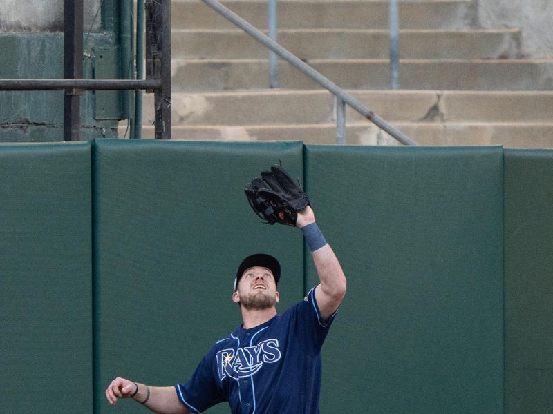 Jun 14, 2023; Oakland, California, USA;  Tampa Bay Rays right fielder Luke Raley (55) catches the ball during the second inning against the Oakland Athletics at Oakland-Alameda County Coliseum. Mandatory Credit: Stan Szeto-USA TODAY Sports