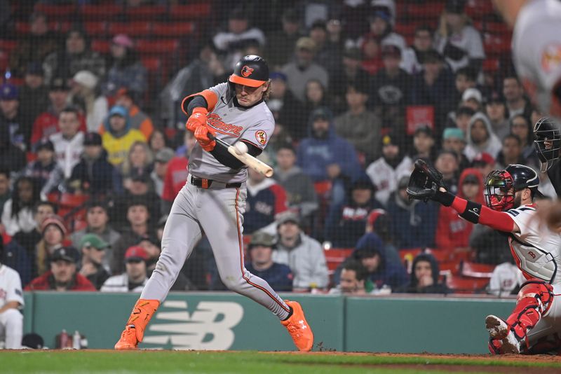 Apr 11, 20024; Boston, Massachusetts, USA; Baltimore Orioles shortstop Gunnar Henderson (2) hits a two run home run against the Boston Red Sox during the tenth inning at Fenway Park. Mandatory Credit: Eric Canha-USA TODAY Sports