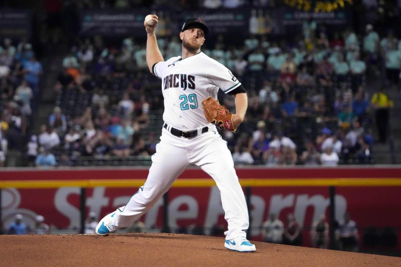 Jul 30, 2023; Phoenix, Arizona, USA; Arizona Diamondbacks starting pitcher Merrill Kelly (29) pitches against the Seattle Mariners during the first inning at Chase Field. Mandatory Credit: Joe Camporeale-USA TODAY Sports