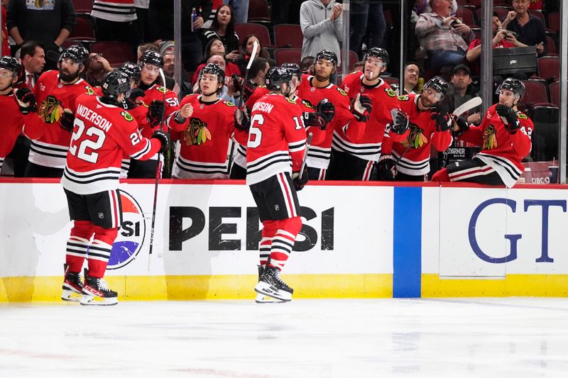 Oct 17, 2024; Chicago, Illinois, USA; Chicago Blackhawks center Jason Dickinson (16) celebrates his goal against the San Jose Sharks during the third period at United Center. Mandatory Credit: David Banks-Imagn Images