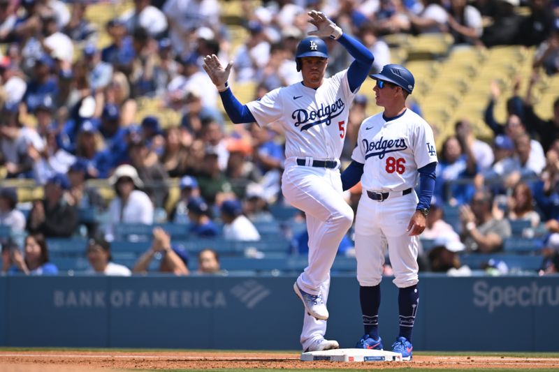 Apr 20, 2024; Los Angeles, California, USA; Los Angeles Dodgers first baseman Freddie Freeman (5) celebrates after hitting an RBI single against the New York Mets during the first inning at Dodger Stadium. Mandatory Credit: Jonathan Hui-USA TODAY Sports