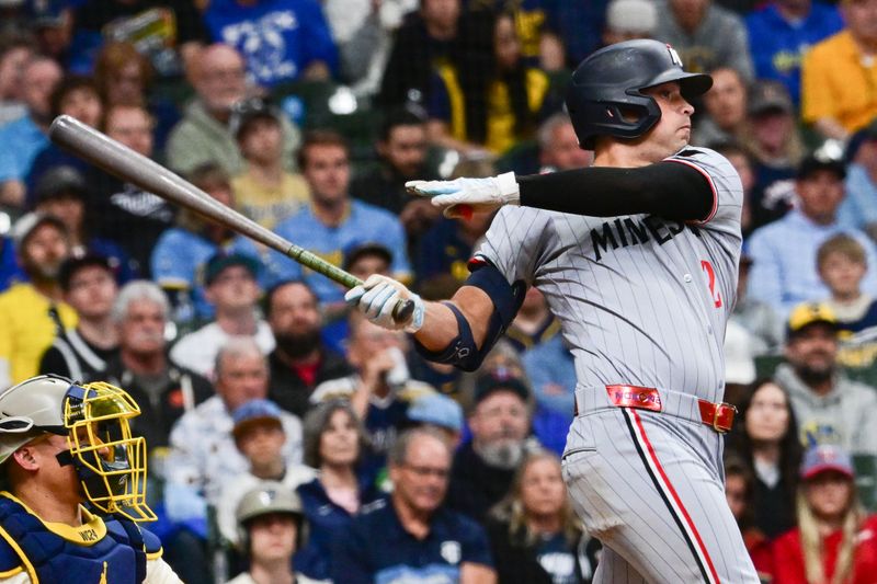 May 17, 2025; Milwaukee, Wisconsin, USA;  Minnesota Twins shortstop Brooks Lee (2) drives in a run with a base hit in the fourth inning against the Milwaukee Brewers at American Family Field. Mandatory Credit: Benny Sieu-Imagn Images