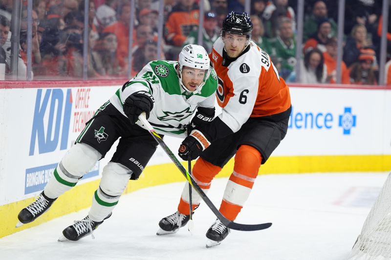Mar 29, 2026; Philadelphia, Pennsylvania, USA; Dallas Stars left wing Michael Bunting (58) battles for position against Philadelphia Flyers defenseman Travis Sanheim (6) in the first period at Xfinity Mobile Arena. Mandatory Credit: Kyle Ross-Imagn Images
