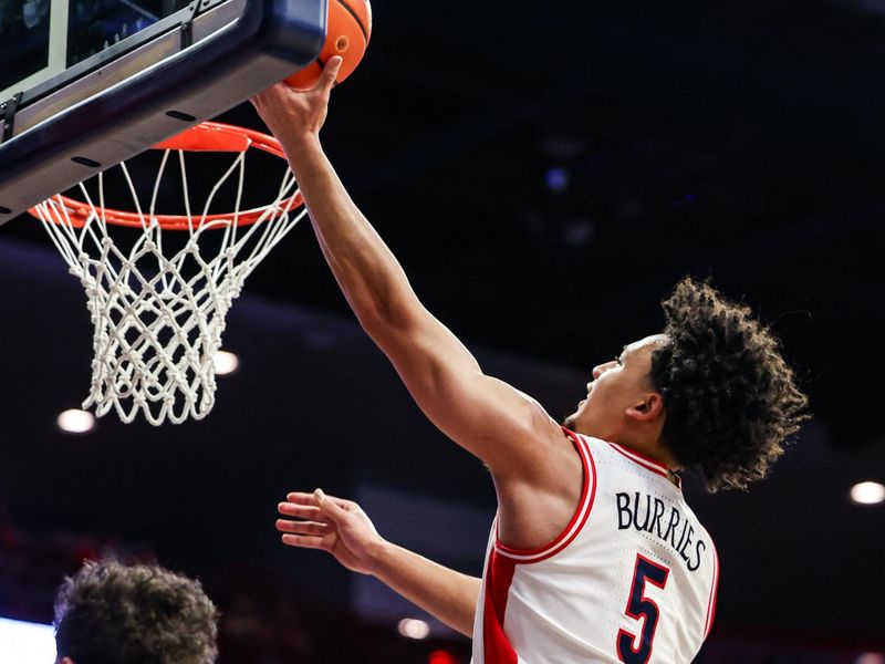 Jan 24, 2026; Tucson, Arizona, USA; Arizona Wildcats guard Brayden Burries (5) makes a layup during the second half of the game against the West Virginia Mountaineers at McKale Memorial Center. Mandatory Credit: Aryanna Frank-Imagn Images