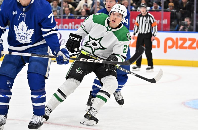 Feb 7, 2024; Toronto, Ontario, CAN; Dallas Stars forward Jason Robertson (21) pursues the play against the Toronto Maple Leafs in the first period at Scotiabank Arena. Mandatory Credit: Dan Hamilton-USA TODAY Sports