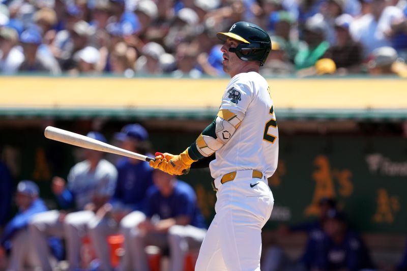 Aug 4, 2024; Oakland, California, USA; Oakland Athletics designated hitter Brent Rooker (25) watches the flight of his home run against the Los Angeles Dodgers during the first inning at Oakland-Alameda County Coliseum. Mandatory Credit: Darren Yamashita-USA TODAY Sports