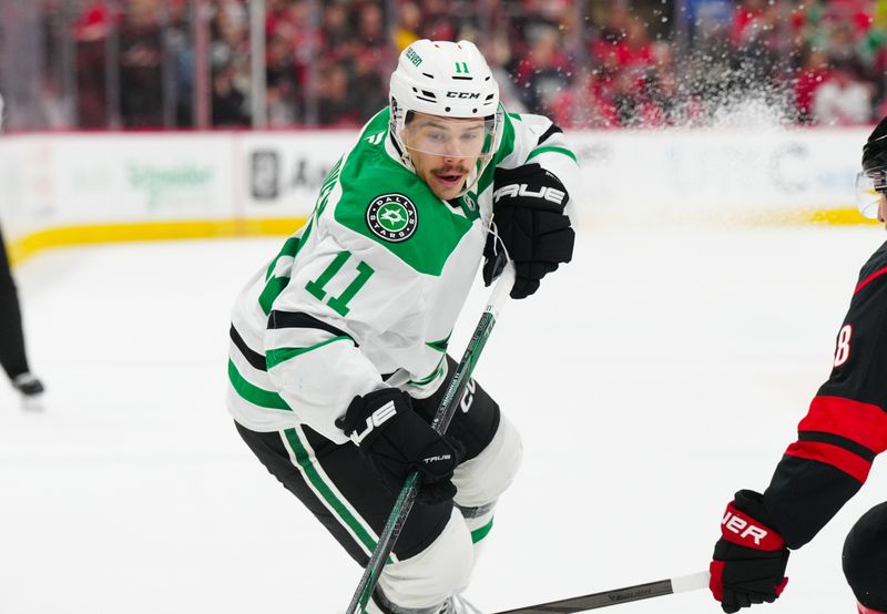 Nov 25, 2024; Raleigh, North Carolina, USA;  Dallas Stars center Logan Stankoven (11) skates against the Carolina Hurricanes during the second period at Lenovo Center. Mandatory Credit: James Guillory-Imagn Images