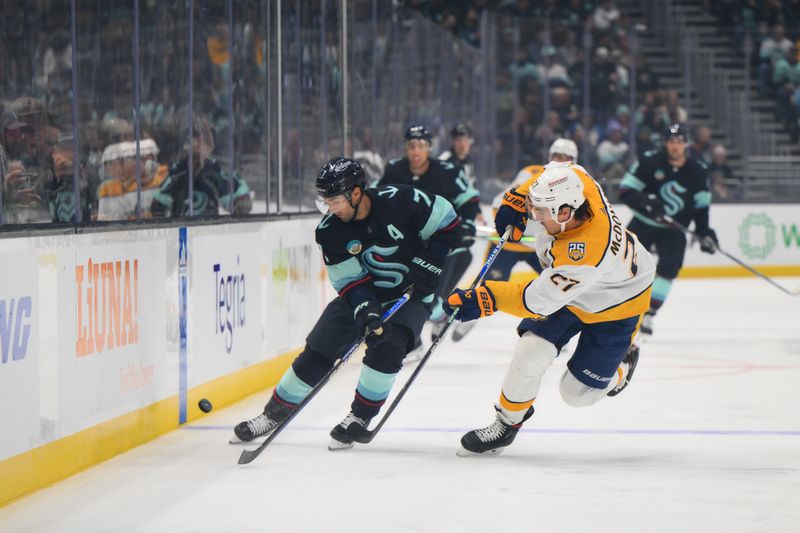 Nov 2, 2023; Seattle, Washington, USA; Seattle Kraken right wing Jordan Eberle (7) and Nashville Predators defenseman Ryan McDonagh (27) play the puck during the first period at Climate Pledge Arena. Mandatory Credit: Steven Bisig-USA TODAY Sports