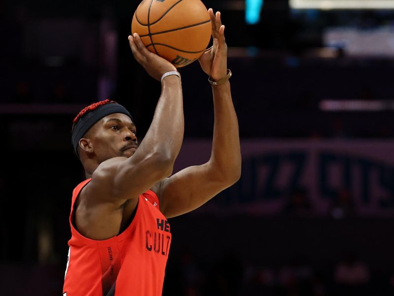 CHARLOTTE, NORTH CAROLINA - NOVEMBER 27: Jimmy Butler #22 of the Miami Heat attempts a jump shot during the second half of the game against the Charlotte Hornets at Spectrum Center on November 27, 2024 in Charlotte, North Carolina. NOTE TO USER: User expressly acknowledges and agrees that, by downloading and or using this photograph, User is consenting to the terms and conditions of the Getty Images License Agreement. (Photo by Jared C. Tilton/Getty Images)