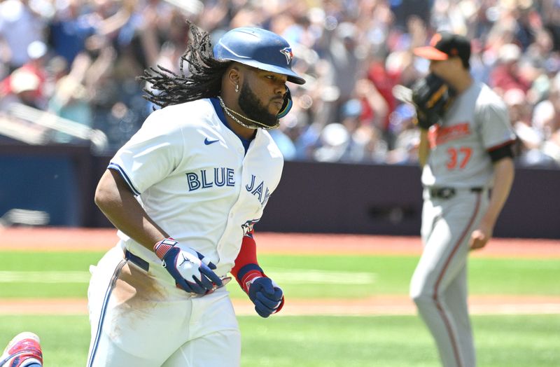 Jun 6, 2024; Toronto, Ontario, CAN;  Toronto Blue Jays first baseman Vladimir Guerrero Jr. (27) runs past Baltimore Orioles pitcher Cade Povich (37) after hitting a three run home run against the Baltimore Orioles in the third inning at Rogers Centre. Mandatory Credit: Dan Hamilton-USA TODAY Sports