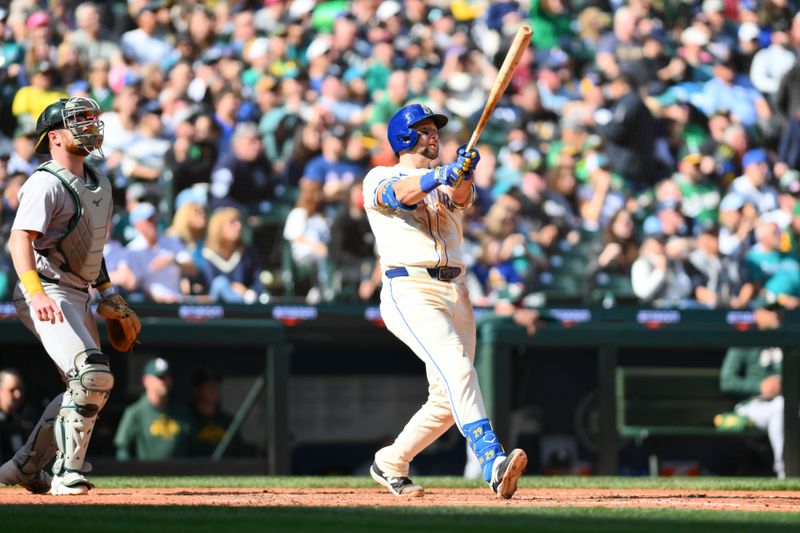 Sep 29, 2024; Seattle, Washington, USA; Seattle Mariners catcher Cal Raleigh (29) hits a 2-run home run against the Oakland Athletics during the fifth inning at T-Mobile Park. Mandatory Credit: Steven Bisig-Imagn Images