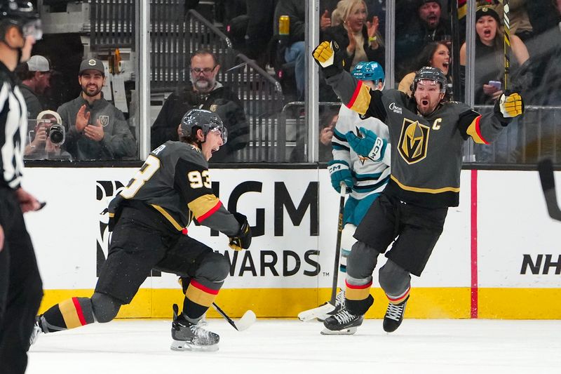 Nov 29, 2025; Las Vegas, Nevada, USA; Vegas Golden Knights right wing Mitch Marner (93) celebrates with Vegas Golden Knights right wing Mark Stone (61) after scoring a goal against the San Jose Sharks during the second period at T-Mobile Arena. Mandatory Credit: Stephen R. Sylvanie-Imagn Images