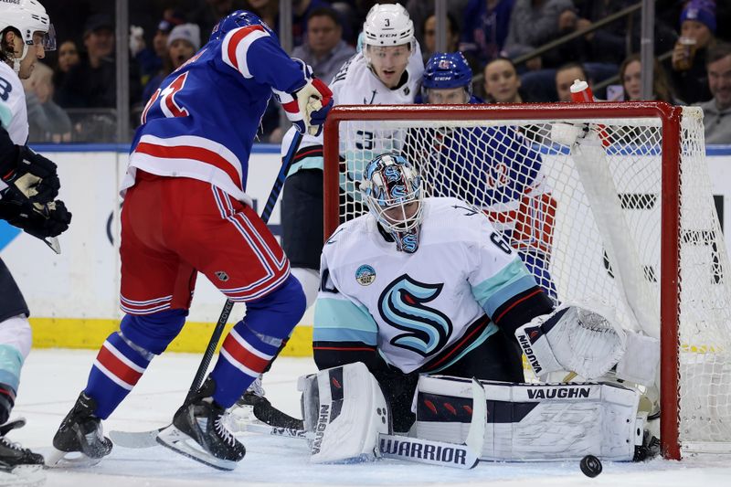 Jan 16, 2024; New York, New York, USA; Seattle Kraken goaltender Chris Driedger (60) makes a save against New York Rangers center Barclay Goodrow (21) during the first period at Madison Square Garden. Mandatory Credit: Brad Penner-USA TODAY Sports