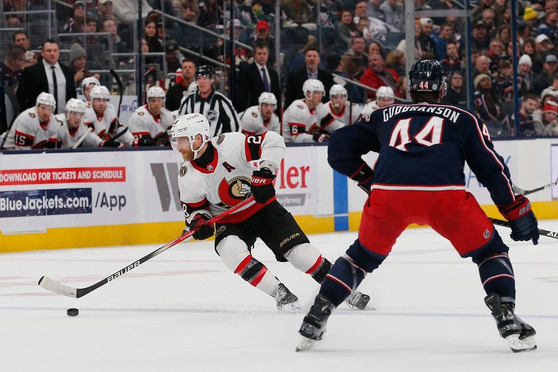 Dec 1, 2023; Columbus, Ohio, USA; Ottawa Senators left wing Claude Giroux (28) skates the puck away from Columbus Blue Jackets defenseman Erik Gudbranson (44) during the first period at Nationwide Arena. Mandatory Credit: Russell LaBounty-USA TODAY Sports