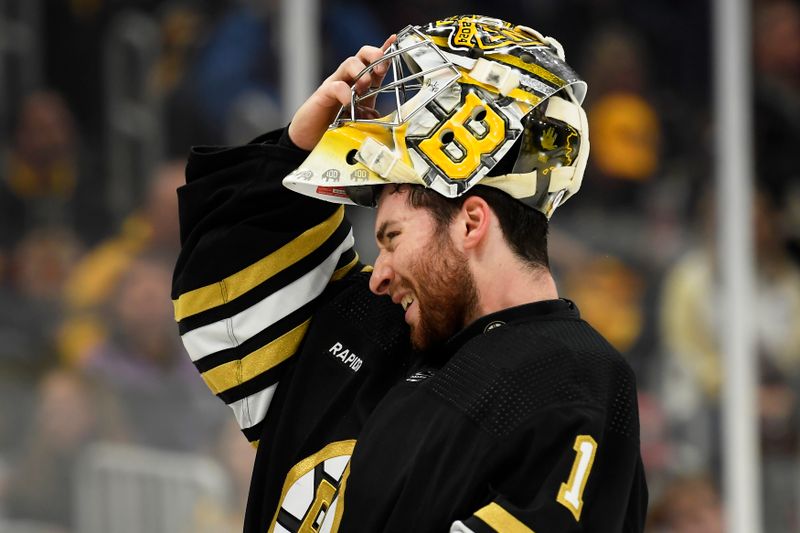 May 12, 2024; Boston, Massachusetts, USA; Boston Bruins goaltender Jeremy Swayman (1) slips on his mask during the second period in game four of the second round of the 2024 Stanley Cup Playoffs against the Florida Panthers at TD Garden. Mandatory Credit: Bob DeChiara-USA TODAY Sports