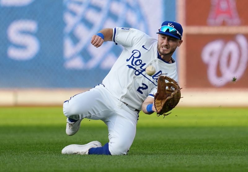 Aug 10, 2024; Kansas City, Missouri, USA; Kansas City Royals right fielder Garrett Hampson (2) makes a sliding catch during the fourth inning against the St. Louis Cardinals at Kauffman Stadium. Mandatory Credit: Jay Biggerstaff-USA TODAY Sports