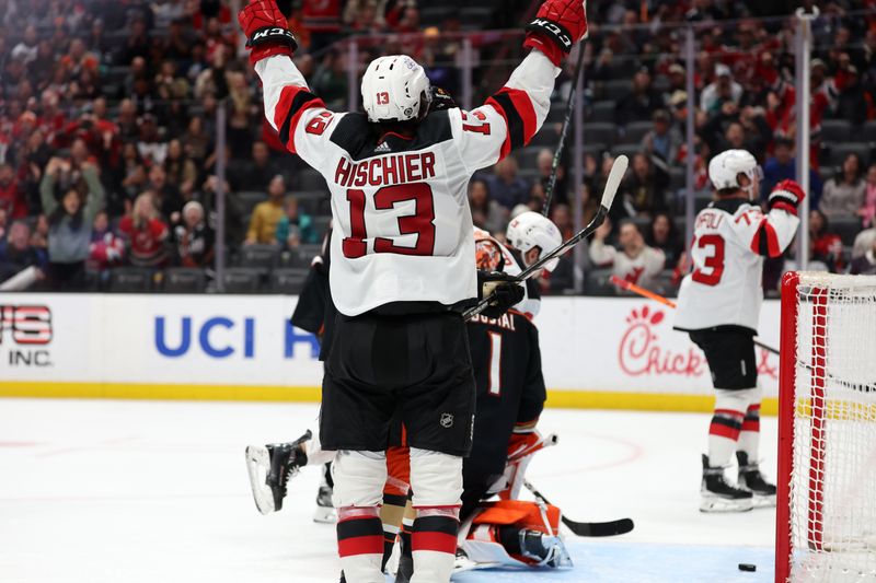 Mar 1, 2024; Anaheim, California, USA; New Jersey Devils center Nico Hischier (13) celebrates after right wing Tyler Toffoli (73) scores a goal during the third period against the Anaheim Ducks at Honda Center. Mandatory Credit: Kiyoshi Mio-USA TODAY Sports