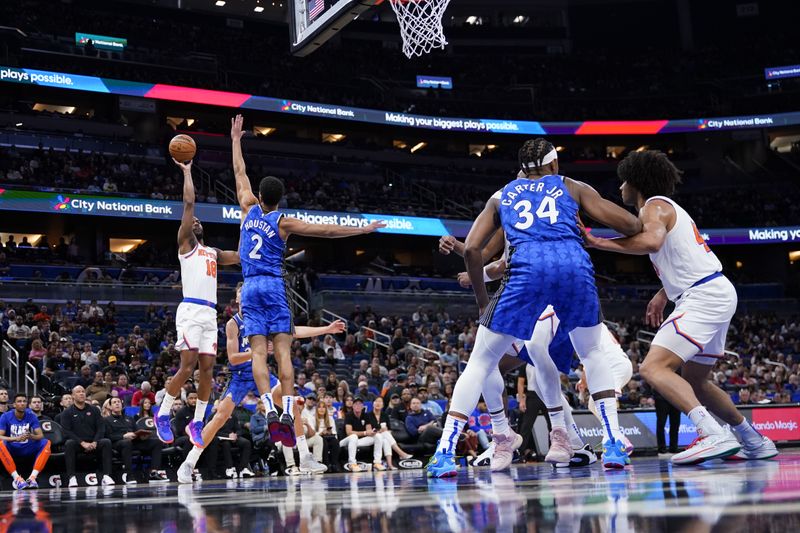 ORLANDO, FLORIDA - FEBRUARY 14: Alec Burks #18 of the New York Knicks goes up for a shot against Caleb Houstan #2 of the Orlando Magic during the first quarter at Kia Center on February 14, 2024 in Orlando, Florida. NOTE TO USER: User expressly acknowledges and agrees that, by downloading and or using this photograph, user is consenting to the terms and conditions of the Getty Images License Agreement. (Photo by Rich Storry/Getty Images)