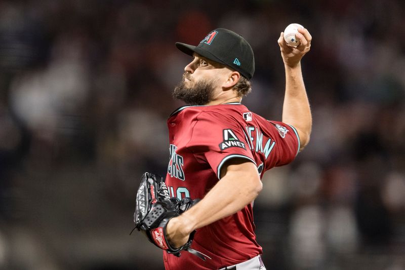 May 13, 2025; San Francisco, California, USA; Arizona Diamondbacks relief pitcher Kendall Graveman (49) throws against the San Francisco Giants during the seventh inning at Oracle Park. Mandatory Credit: John Hefti-Imagn Images