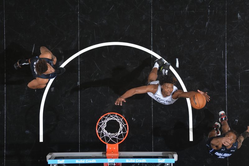 SAN ANTONIO, TX - OCTOBER 9: Harrison Ingram #55 of the San Antonio Spurs rebounds the ball during the game against the Orlando Magic during a NBA preseason game on October 9, 2024 at the Frost Bank Center in San Antonio, Texas. NOTE TO USER: User expressly acknowledges and agrees that, by downloading and or using this photograph, user is consenting to the terms and conditions of the Getty Images License Agreement. Mandatory Copyright Notice: Copyright 2024 NBAE (Photos by Michael Gonzales/NBAE via Getty Images)