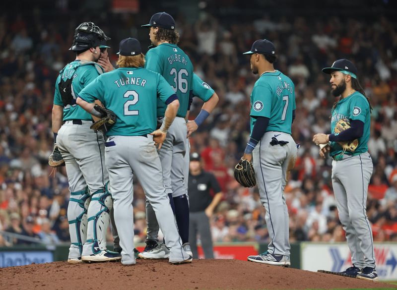 Sep 24, 2024; Houston, Texas, USA; Seattle Mariners starting pitcher Logan Gilbert (36) gets a pitchers mound visit after the Houston Astro load two men on base in the sixth inning at Minute Maid Park. Mandatory Credit: Thomas Shea-Imagn Images