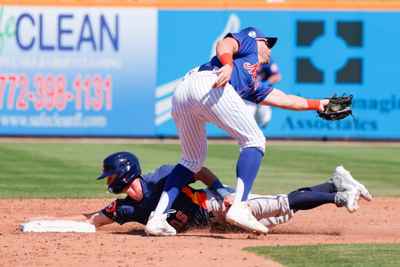 Feb 28, 2023; Port St. Lucie, Florida, USA; Houston Astros third baseman Rylan Bannon (38) slides ahead of the tag from New York Mets second baseman Jeff McNeil (1) during the second inning at Clover Park. Mandatory Credit: Reinhold Matay-USA TODAY Sports