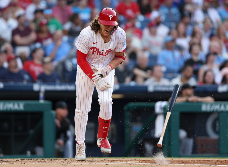 Aug 14, 2024; Philadelphia, Pennsylvania, USA; Philadelphia Phillies third base Alec Bohm (28) slams his bat in reaction to popping out to end the first inning against the Miami Marlins at Citizens Bank Park. Mandatory Credit: Bill Streicher-USA TODAY Sports